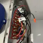 Copper pipes and a blue filter-drier on refrigeration equipment