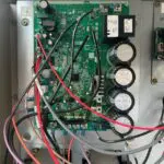 Green circuit board with black electronic components