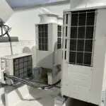 Large gray outdoor HVAC unit on a concrete pad